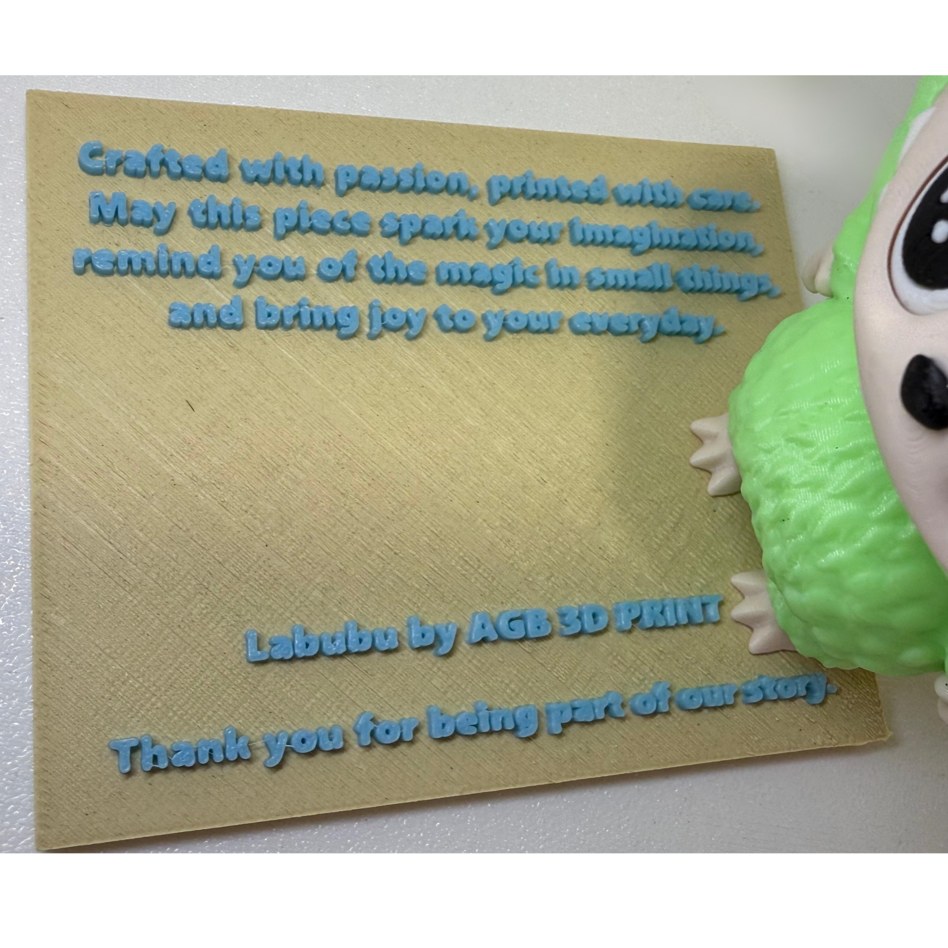 Front view of glowing green Labubu figurine with detailed fur texture and expressive eyes on soft green gradient background.